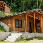 Wooded hillside camp cabins at a summer camp facility available for group rental